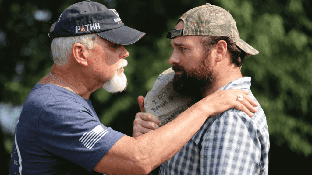 Two American veterans embracing each other.